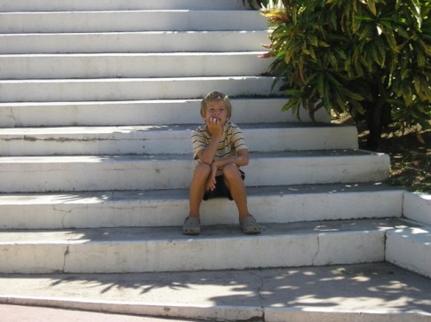l John sitting on the church steps in Les Saints